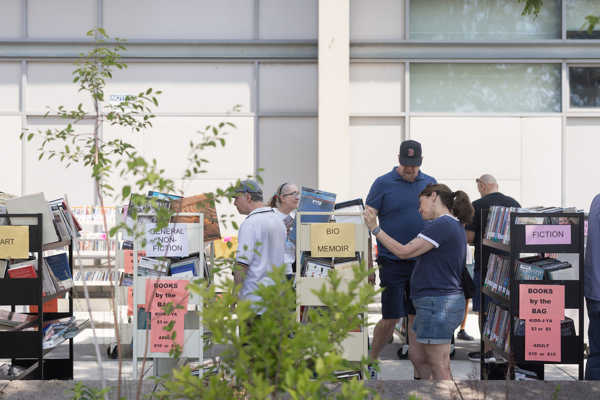 People browsing a Friends of WPL books sale.