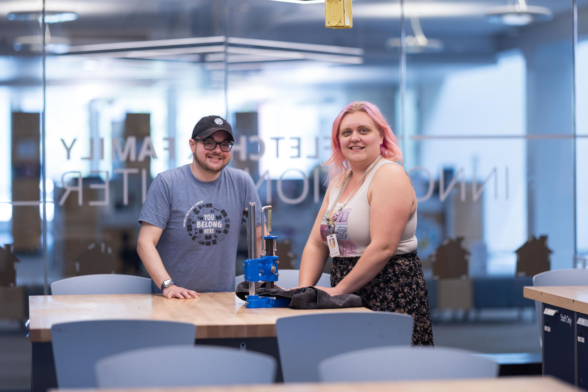 Inside of Innovation Center with two staff members, points to Innovation Center page.