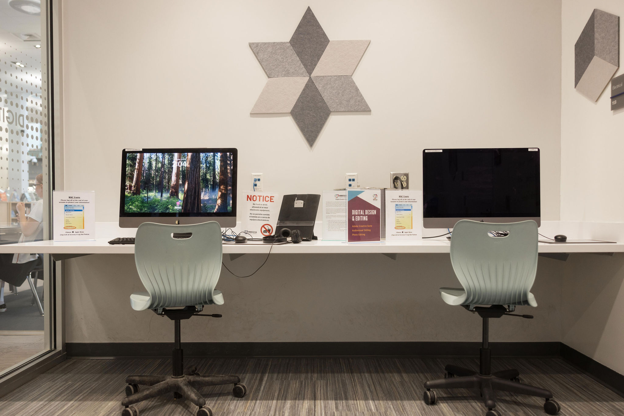 Inside of Digital Studio with computers, points to Digital Studio page.