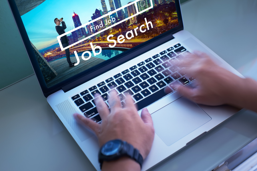 Laptop with job search open on screen, points to employment resources.