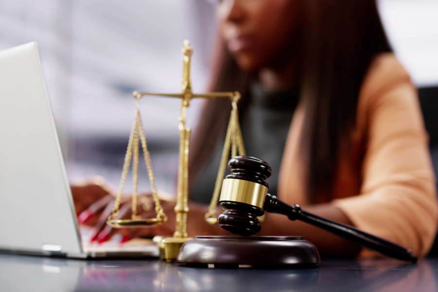Person giving legal advice, points to legal aid resources.
