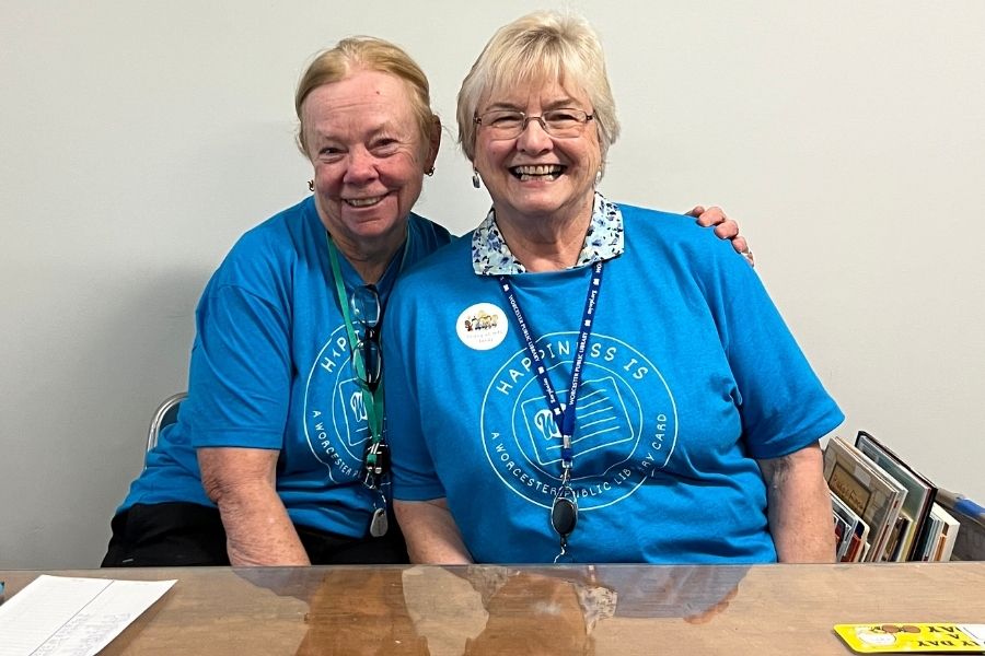 Pair of Friends volunteers in the bookstore.